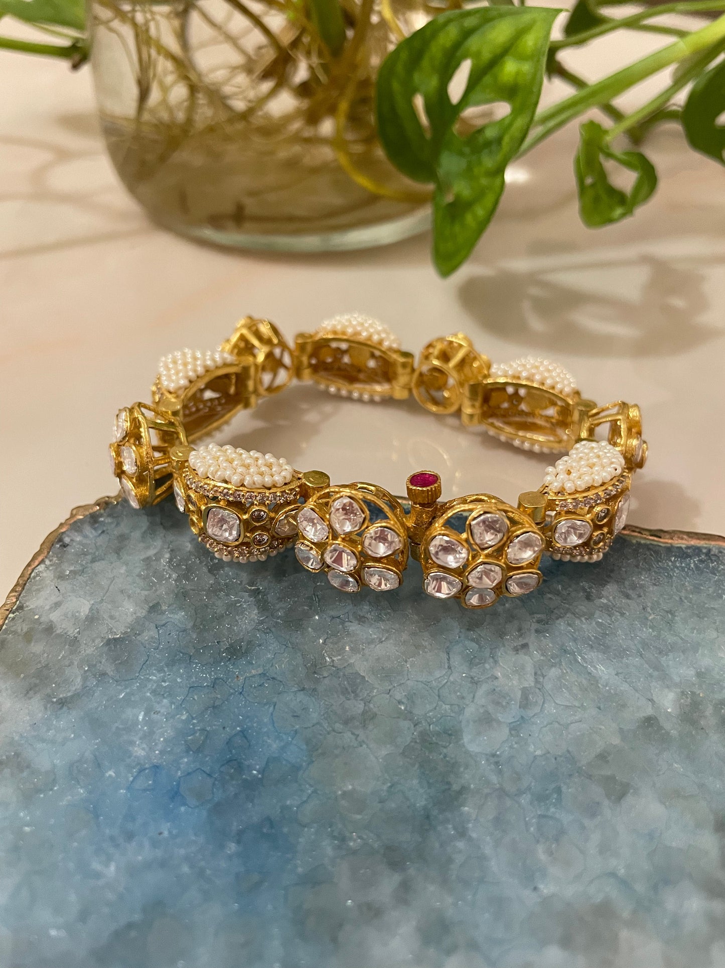 Kundan in mosaic of rose-hued gemstones and creamy pearls