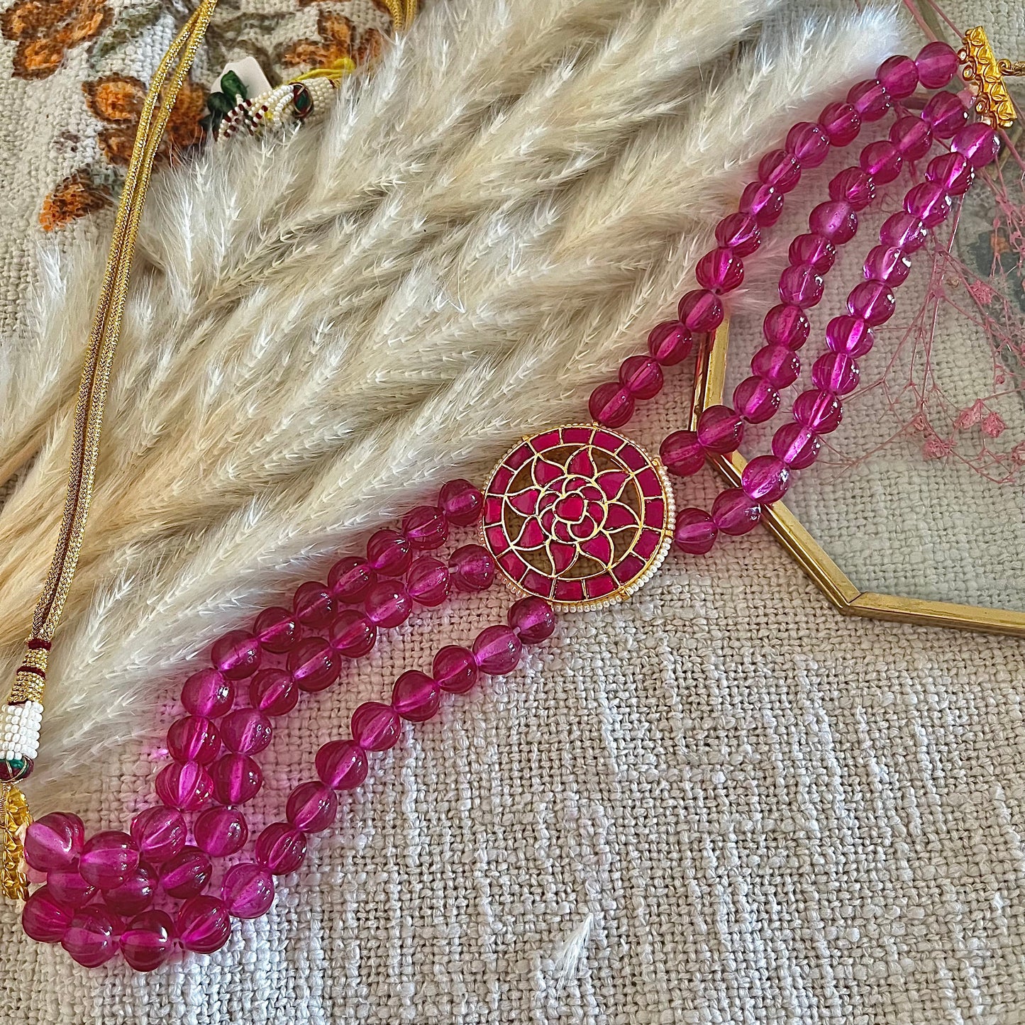 Ruby choker with three layered strings